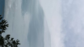 Vertical video - Timelapse of dramatic lenticular clouds hovering in the sky - Powered by Shutterstock - Get 15% off with code: PIKWIZARD15