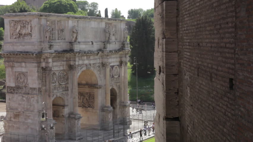 The Arch of Constantine stands aside the Colosseum
