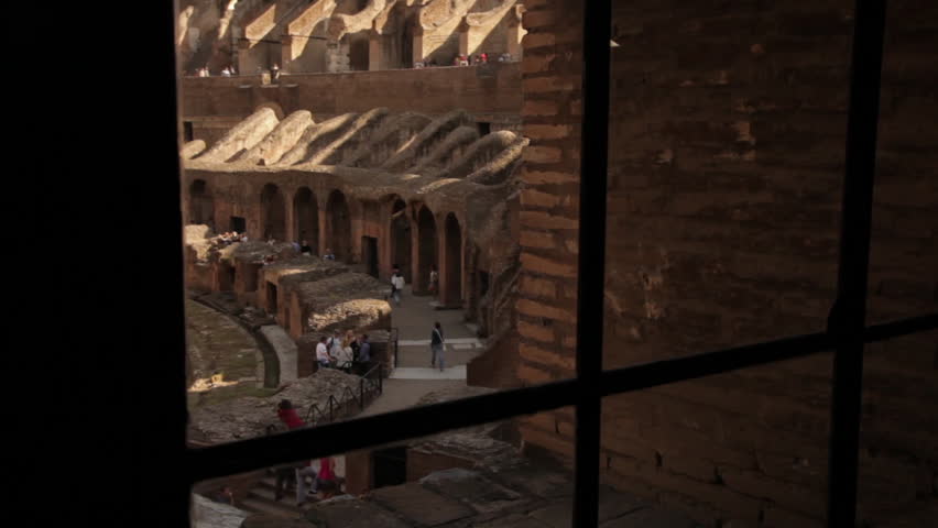 Behind bars overlooking tourists in Colosseum