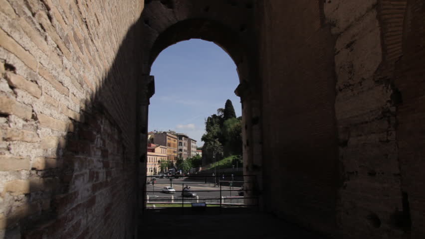 Street view from the Colosseum through an arch.