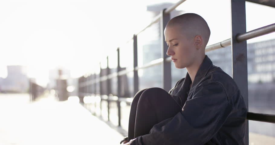 Young woman ouside starring into space