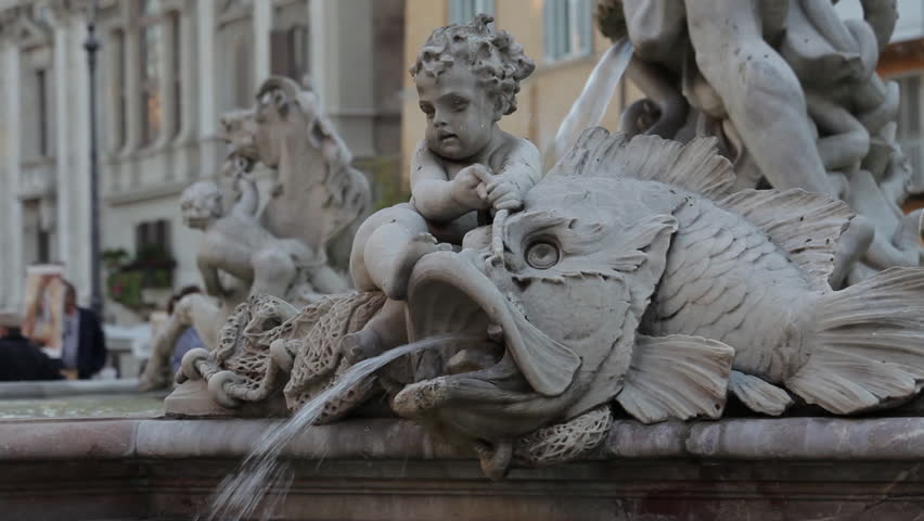Fish and child stone water fountain in Rome