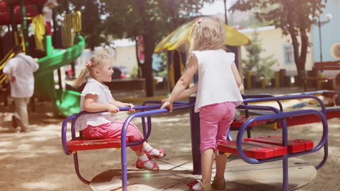 Three happy girls on the playground