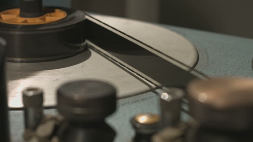 Film rolling in old film editing equipment start and stop Royalty-Free Stock Footage #33834193