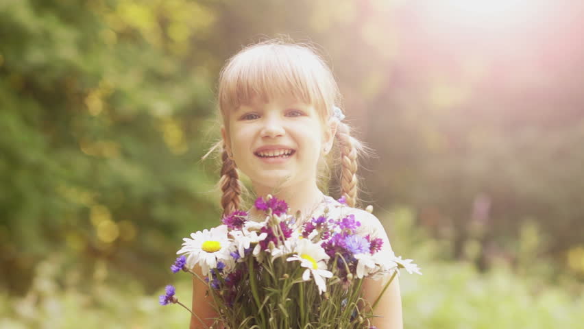 Laughing girl with a bouquet of flowers