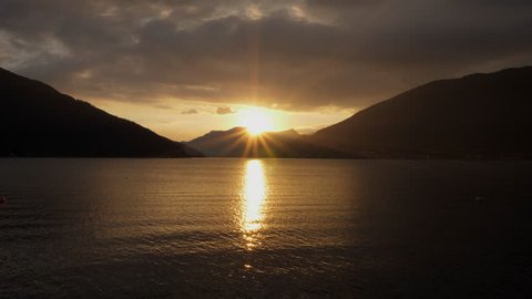 Lugano Lake. Backlight Sunset on the lake