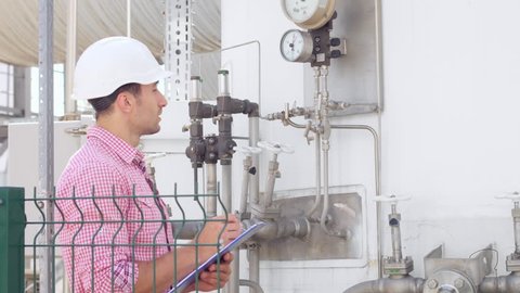Operator check parameters on instrumentation at chemical factory
