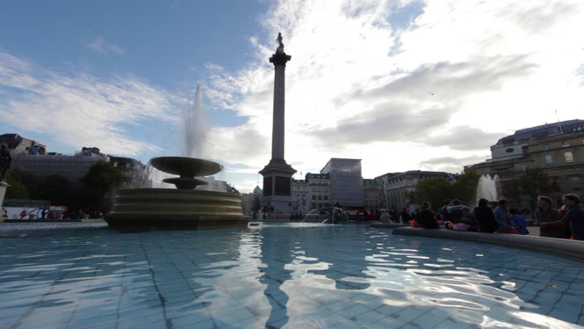 People by a fountain on Trafalgar Square