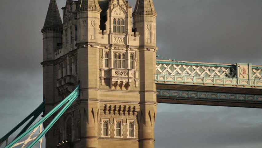 Dark clouds behind the top of the left tower on Tower Bridge in London, England.