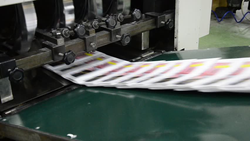 finished brochure magazine goes on the packaging line after it is printed on the