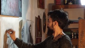 artist draws a portrait  with a pencil - 4k video
