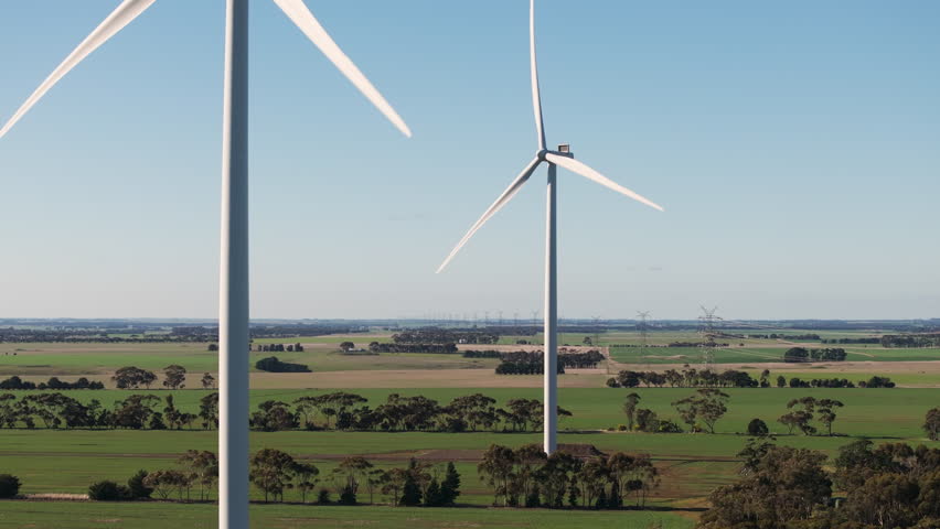 Drone flying near two wind turbines in Southwest Victoria, Australia. Royalty-Free Stock Footage #3384705481
