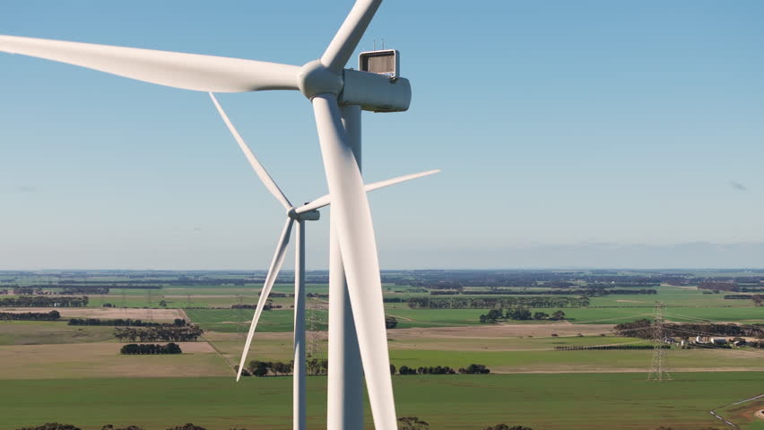 Drone ascending over two turbines in Southwest Victoria, Australia. Royalty-Free Stock Footage #3384753471