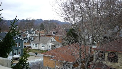 Establishing shot of homes in Western Pennsylvania town on early winter afternoon