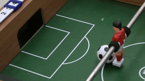 table soccer,Sportsmen shoot open goal