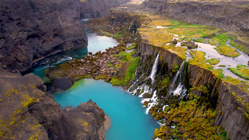 Epic Drone Landscape Canyon of Waterfalls in Sigoldugljufur Iceland. Drone Flies Backward And Upward Out of Canyon to Wide with Vibrant Colors. 4K High Quality Color Corrected.