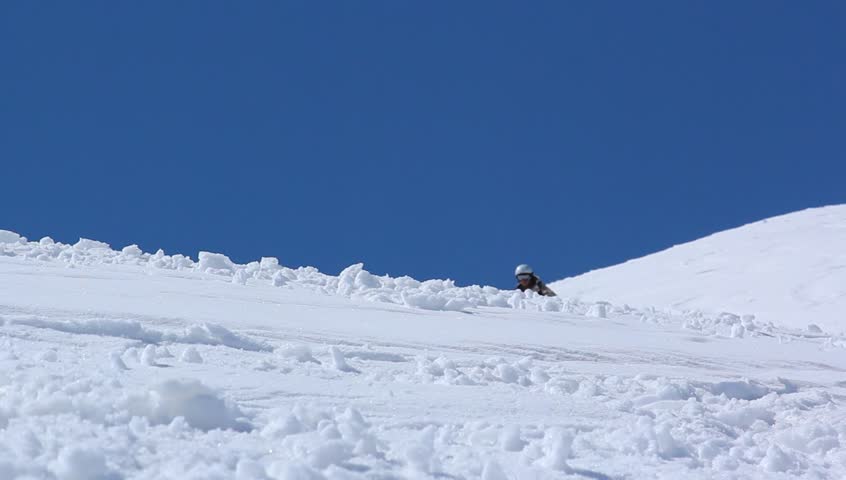 Skier close-up in soft snow on a sunny give against the clear sky Royalty-Free Stock Footage #3386243