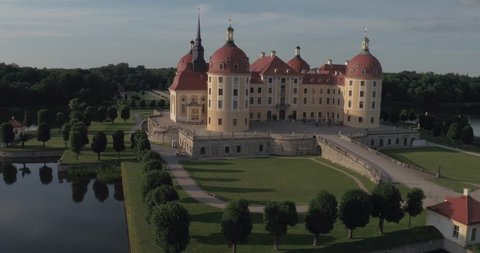 Aerial Drone rounding backwards castle Moritzburg in Germany 4k 