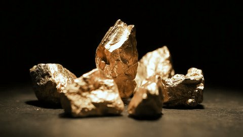 mound of gold with a big gold nugget, footage