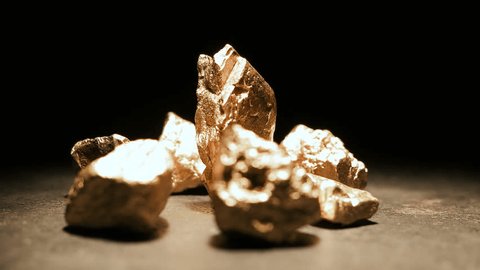 big gold nugget with a mount of gold