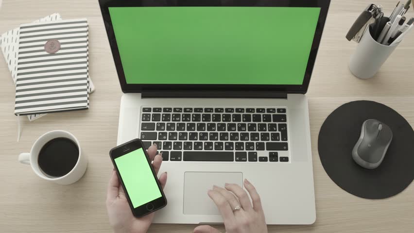 Working on laptop using touch pad and holding smartphone. Woman fingers scrolling website using track pad for shopping online from home. Green screen. Network communications or online shopping. Royalty-Free Stock Footage #33869605