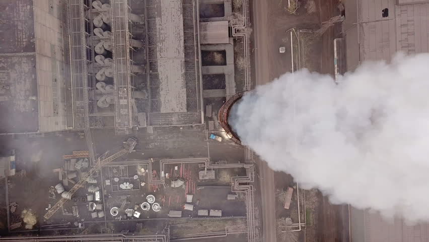 Aerial view. Emission to atmosphere from industrial pipes. Smokestack pipes shooted with drone. Close-up. Royalty-Free Stock Footage #33870343