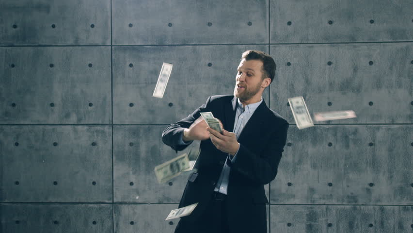 Man in formal suit dancing and throwing money. Slow motion | Shutterstock HD Video #33872305