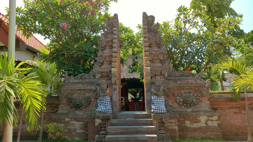 the gate is full of Balinese carvings