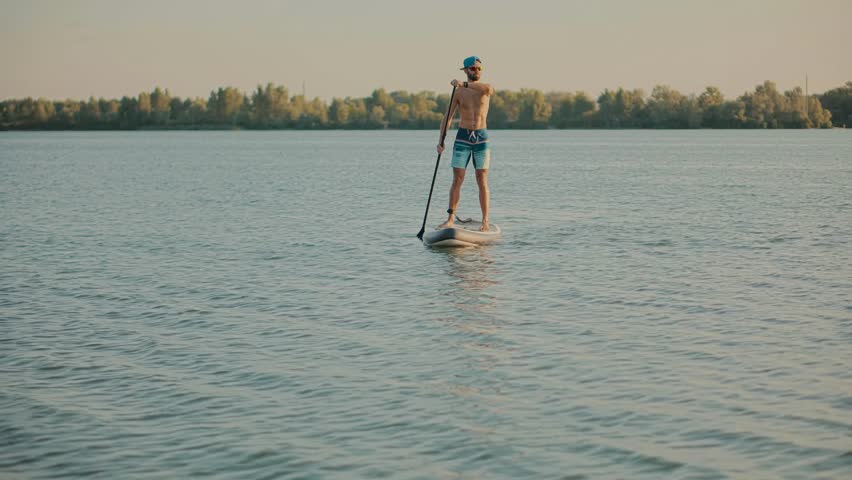 Paddleboarder Sport Sup Surfing. Recreation Paddling Sup Surfboard. Inflatable Board Rowing. Surfer Recreation Sport Watersport Activity.Travelling Water Tourism. Raft SUP. Paddler Surfing Exploration Royalty-Free Stock Footage #3387862105