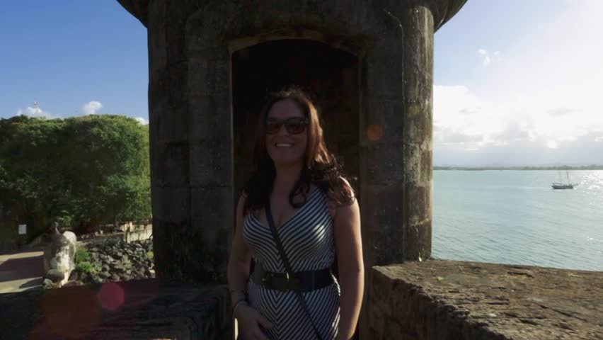 Woman smiling as she comes from seeing Garita in Old San Juan, Puerto Rico
