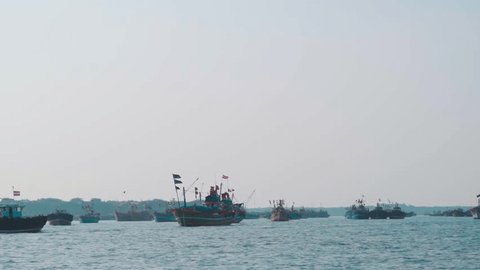 View of boats in Arabian sea at Okha port, Gujarat, India. Concept of transportation in sea. Passenger boat during holidays. Fishing boats at the port with Indian flag on top of them. Stockvideo