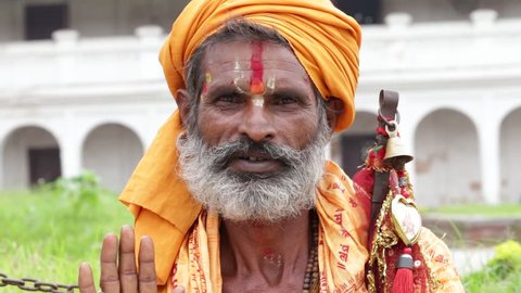 KATHMANDU, NEPAL - SEPTEMBER 29, 2016 : Portrait Sadhu at Pashupatinath Temple in Nepal. Sadhu is a holy man, who have chosen to live an ascetic life and focus on the spiritual practice of Hinduism.