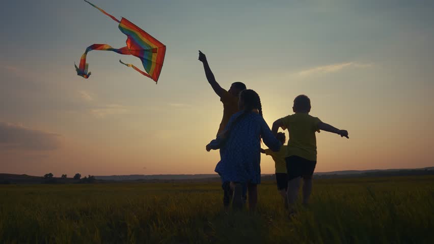 family running in park. group of kids and family running in park silhouette playing with kite. happy family kid dream concept. happy family kids run play at lifestyle sunset nature with kite Royalty-Free Stock Footage #3389785051