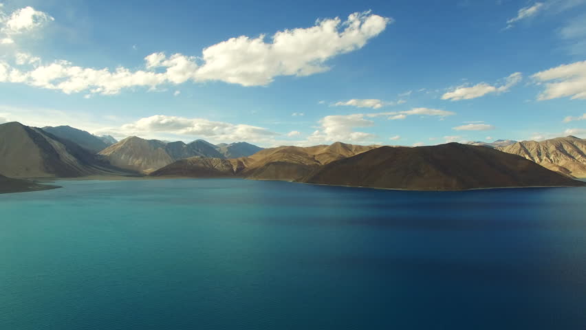 Aerial View. Himalayan lake. Flying over the beautiful lake near mountains. Aerial camera shot. Landscape panorama. Himalaya. Pangong Lake, Leh Ladakh, 4600m high from the ground.