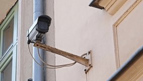 Street Surveillance Camera Installed on Building Facade