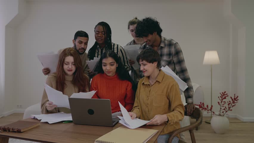 Happy overjoyed students are excited about holidays or vacation, throwing papers away, celebrating the end of semester, success, friendship. Colleagues dancing feeling joy of succeded work at office