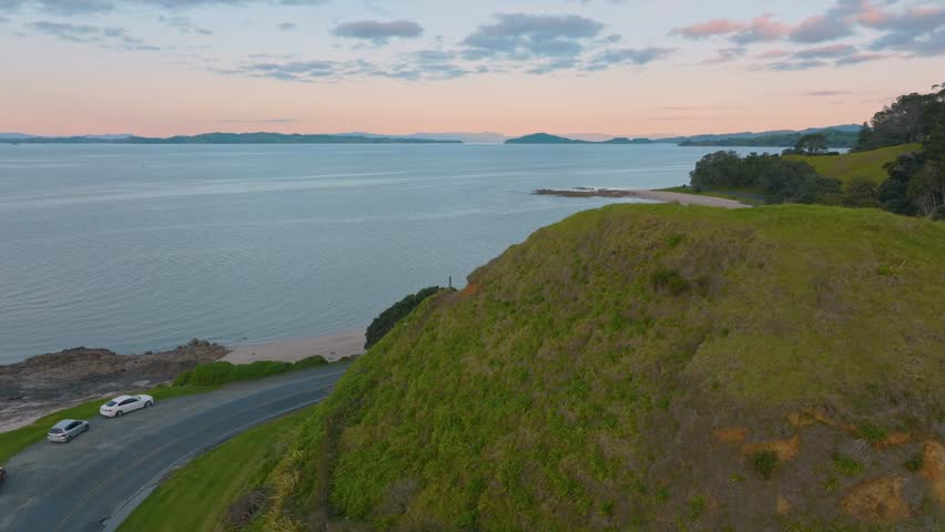 Aerial: Beach and suburb and wharf of Maraetai, Auckland, New Zealand
