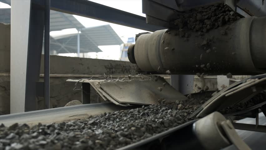 Belt Conveyor, Cold Elevator and hopper to supply cold aggregate from cold bin. Distribute cold aggregate via belt feeder to aggregate belt conveyor according to certain proportions Royalty-Free Stock Footage #3390450129