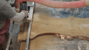 Focused carpentry work at a table saw, a testament to attention to detail. Reflects the resurgence of bespoke woodwork in modern interiors. - Powered by Shutterstock - Get 15% off with code: PIKWIZARD15