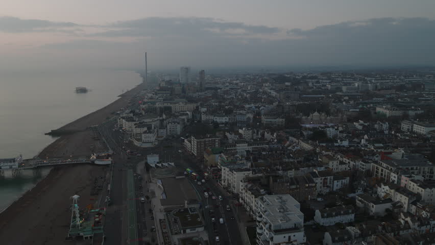 Establishing Aerial View Shot of Brighton UK, East Sussex, England United Kingdom, moody cinematic light Royalty-Free Stock Footage #3390525507