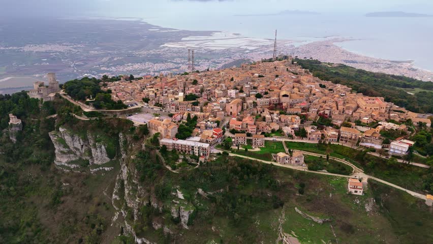Erice old town, Sicily, Italy. Aerial shot of old houses with orange roofs on top of mountain Royalty-Free Stock Footage #3390539777