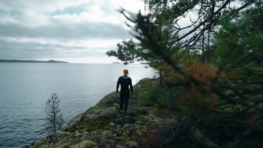 One Athletic Man At Top Of Mount, Admiring Beautiful Landscape With Lake From High After Climbing