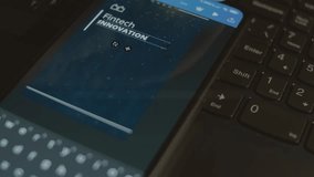 Fintech innovation inscription on smartphone. Designer making an advertisement design on mobile app. Banking concept - Powered by Shutterstock - Get 15% off with code: PIKWIZARD15