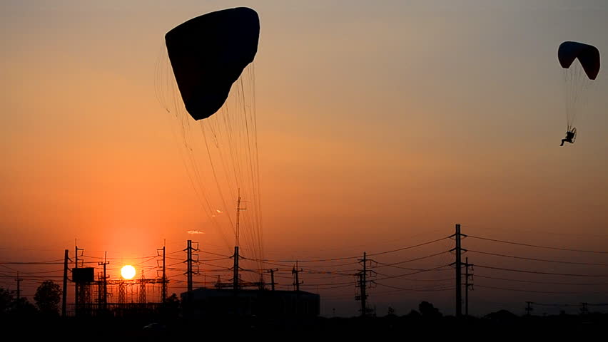 paramotor flying on sunset time