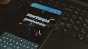 Fintech innovation inscription on smartphone. Designer making an advertisement design on mobile app. Banking concept - Powered by Shutterstock - Get 15% off with code: PIKWIZARD15