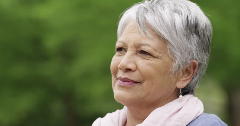 Senior woman, thinking and planning in outdoors, relaxing and smile for future in retirement. Happy mexican person, idea and contemplating choice or decision, joy and remember nostalgia or memory Royalty-Free Stock Footage #3390612951