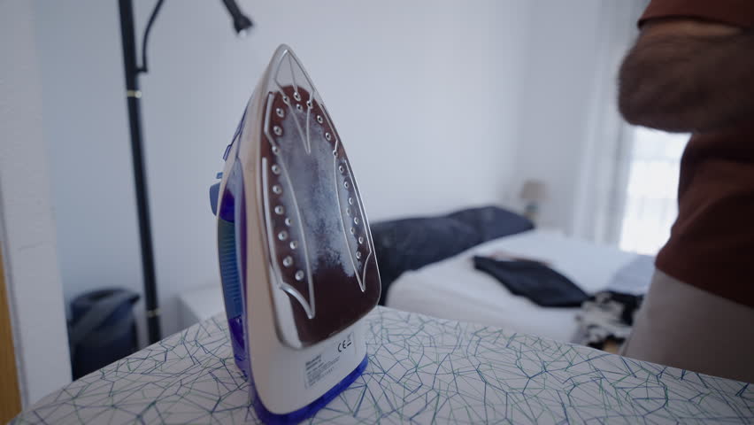 Close-up of an iron ready to iron clothes