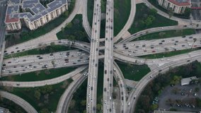 Aerial Overhead View of Famous Interchange in United States, Traffic in Interstate 110 and 10 Highway Full of Cars and Trucks Rush hour. Transportation. - Powered by Shutterstock - Get 15% off with code: PIKWIZARD15