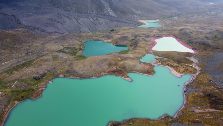 Aerial Drone View hike the seven 7 lakes of Ausangate cusco, Peru clouddy day green water mountains 4k