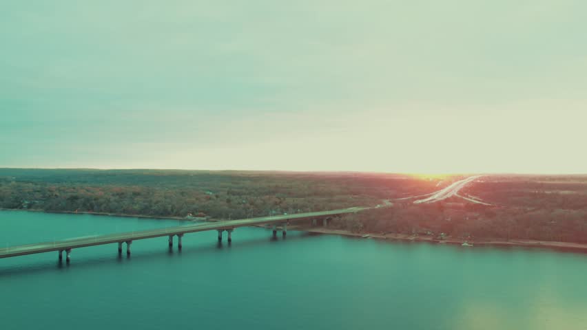 St. Croix River Bridge in Lakeland Minnesota bordering with Wisconsin. Serene bridge and boat docks in golden hour light.